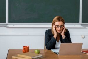 Stressed out teacher in a school