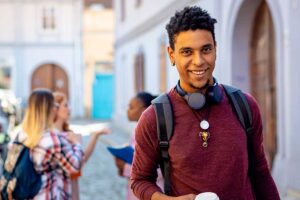 Student outside a university building