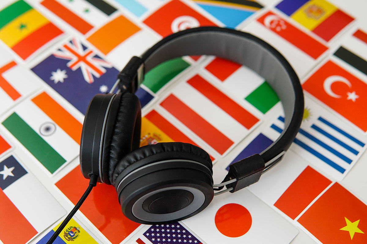 Flags and a pair of headphones to denote a cross-language plagiarism concept